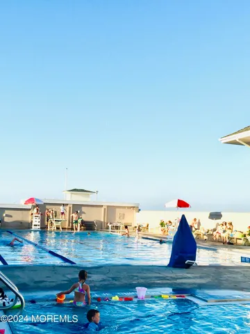 a view of swimming pool with seating