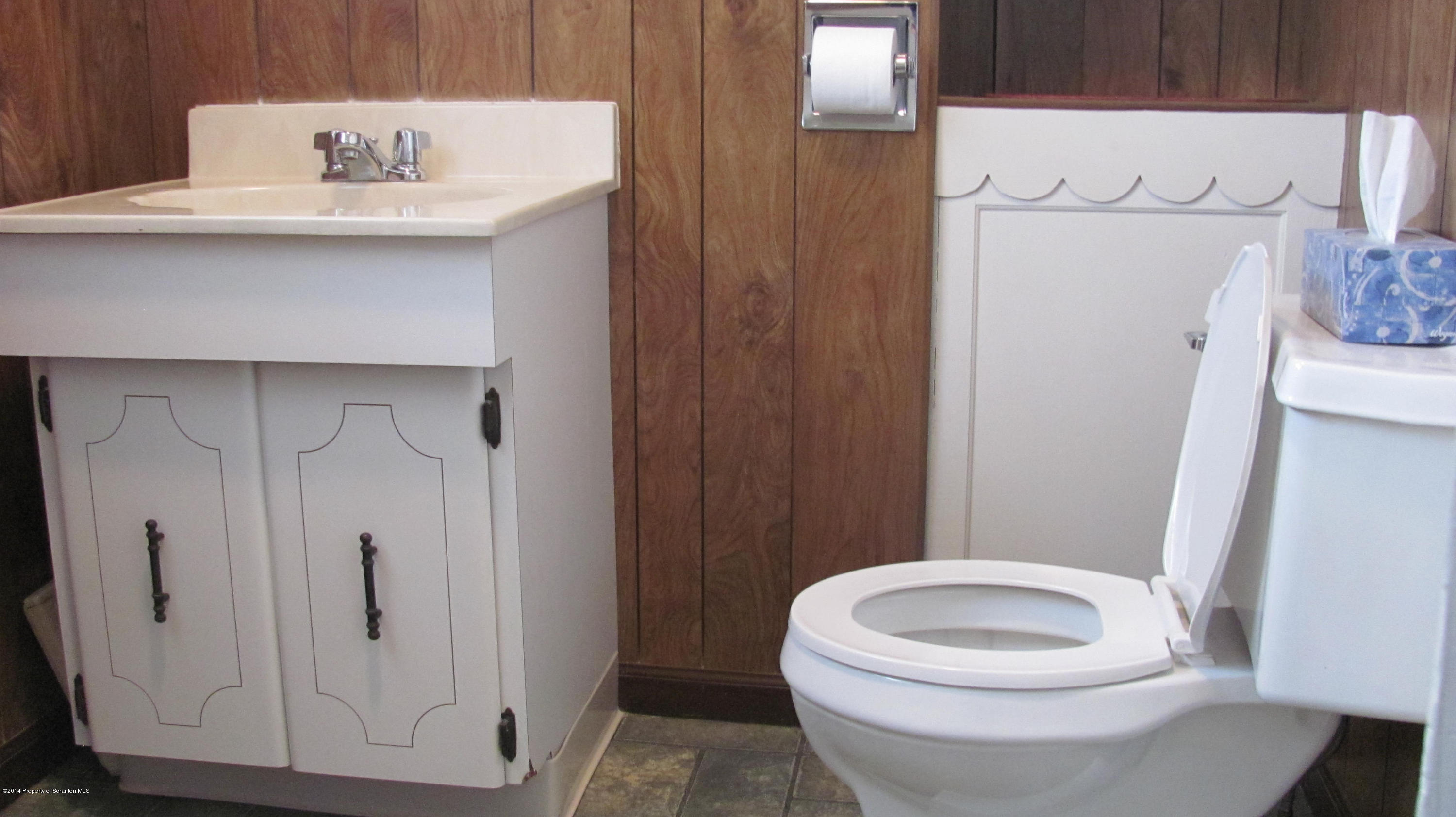 901 Scott Road Dickson City, PA 18519 - Photo 12 of 24 a white toilet sitting next to a bathroom sink