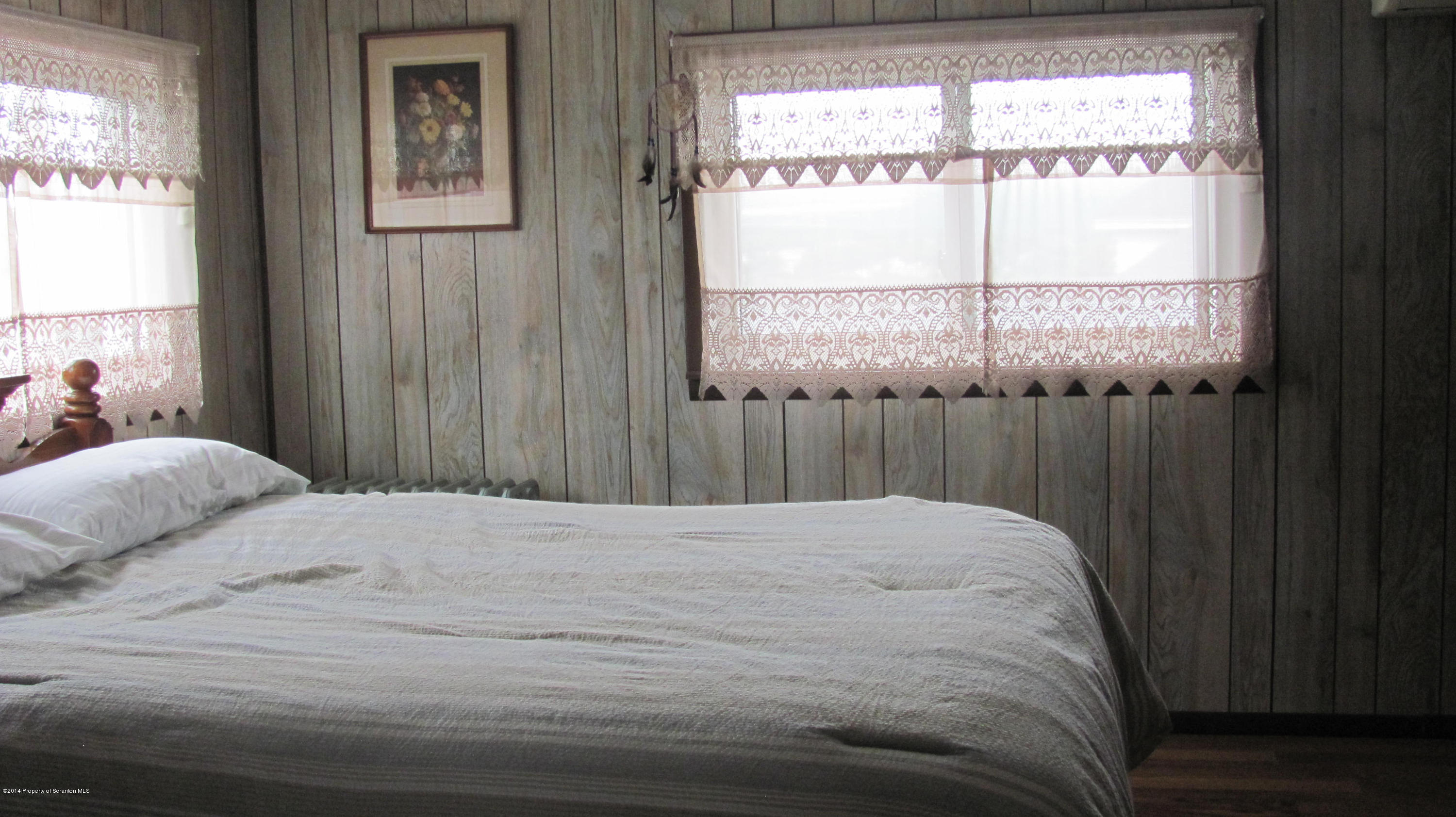 901 Scott Road Dickson City, PA 18519 - Photo 14 of 24 a bedroom with a bed and a window