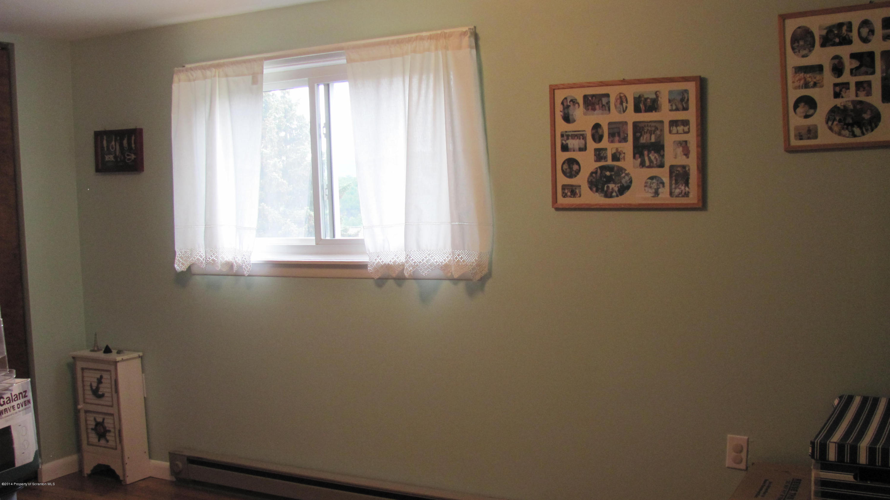 901 Scott Road Dickson City, PA 18519 - Photo 19 of 24 a view of an empty room with a window
