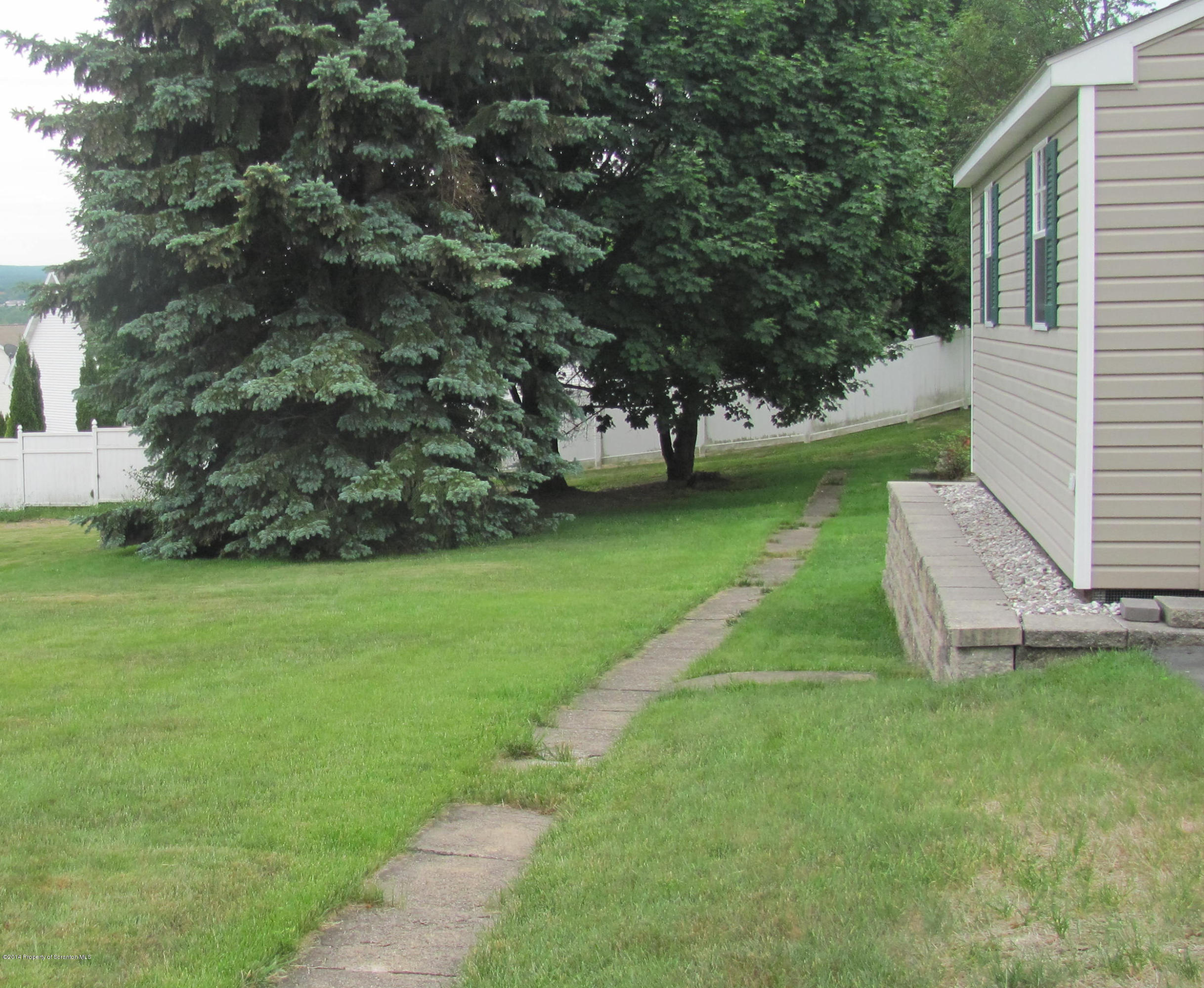 901 Scott Road Dickson City, PA 18519 - Photo 3 of 24 a view of a backyard with large trees