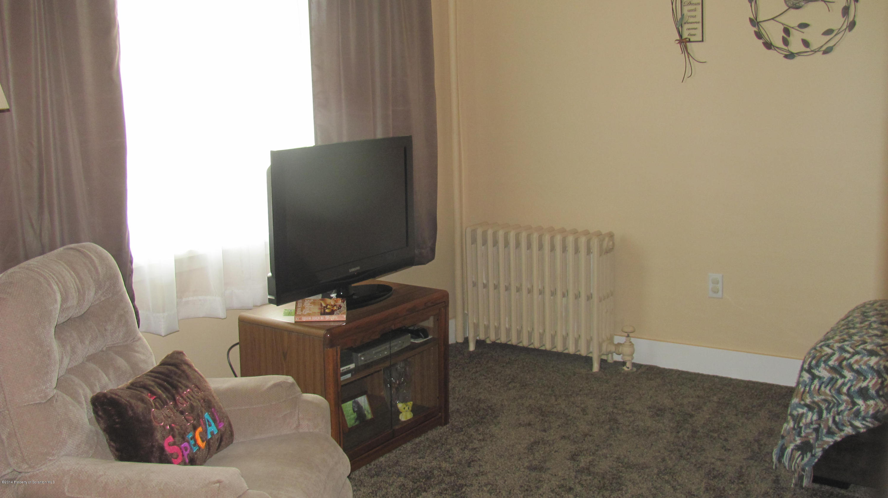 901 Scott Road Dickson City, PA 18519 - Photo 5 of 24 a living room with furniture and a flat screen tv
