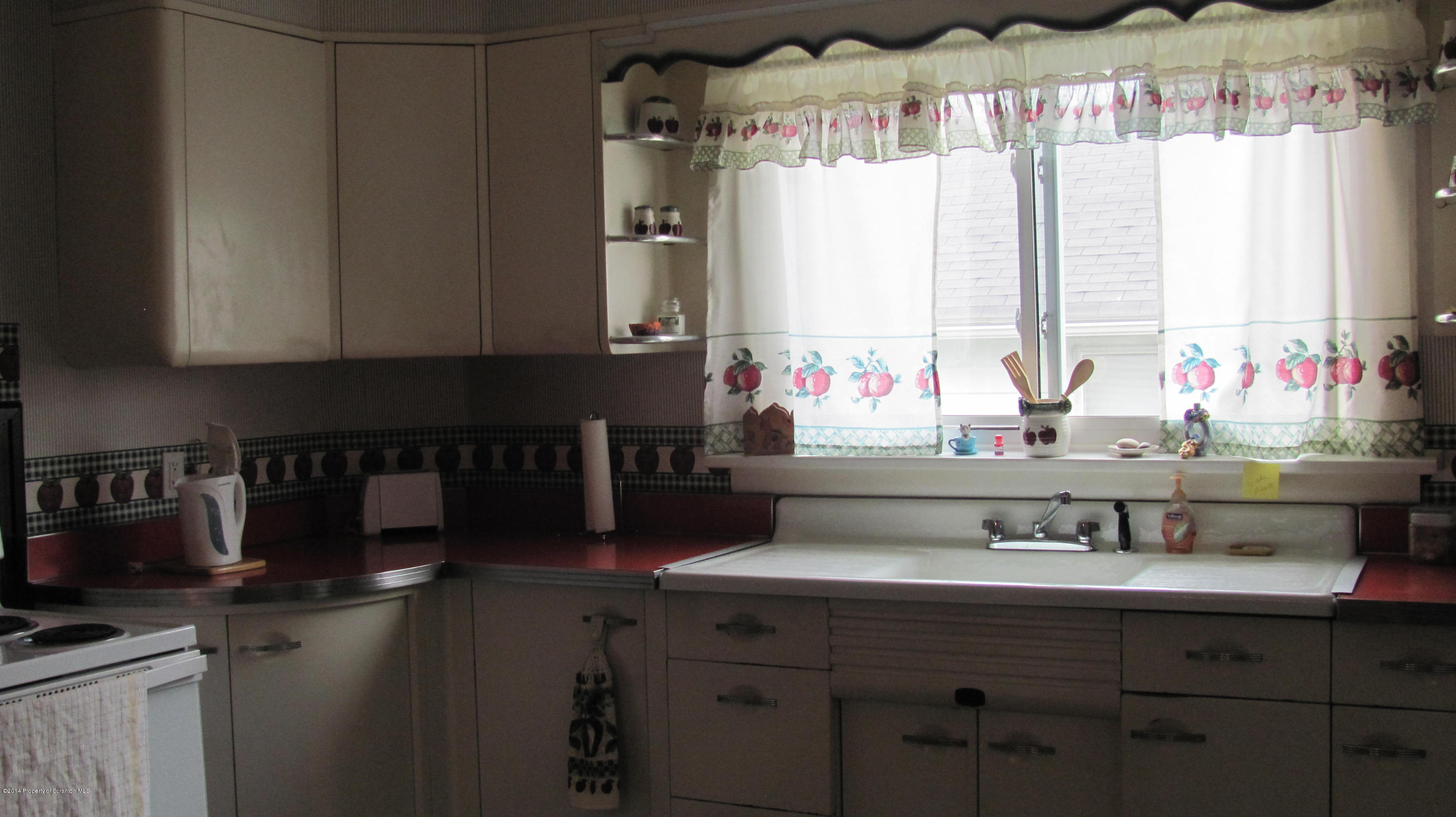 901 Scott Road Dickson City, PA 18519 - Photo 7 of 24 a kitchen with a sink and a window
