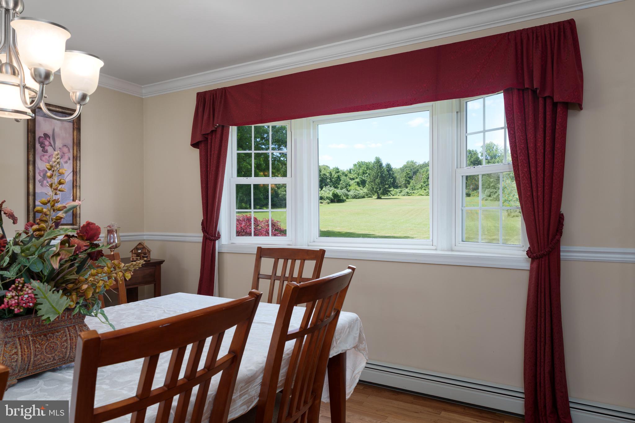 56 Valley Road Lambertville, NJ 08530 - Photo 22 of 49 a view of a dining room with furniture window and wooden floor