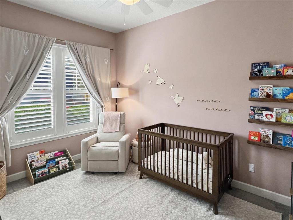 12912 Southwest 3rd Place Newberry, FL 32669 - Photo 21 of 38 a bedroom with furniture and a book shelf