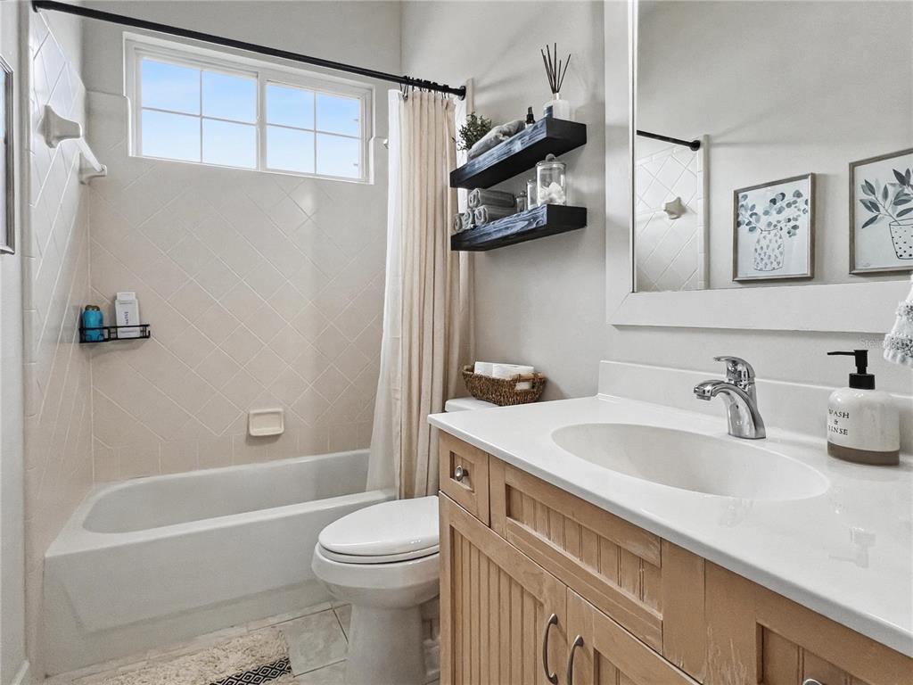 12912 Southwest 3rd Place Newberry, FL 32669 - Photo 23 of 38 a bathroom with a sink a toilet and a bathtub