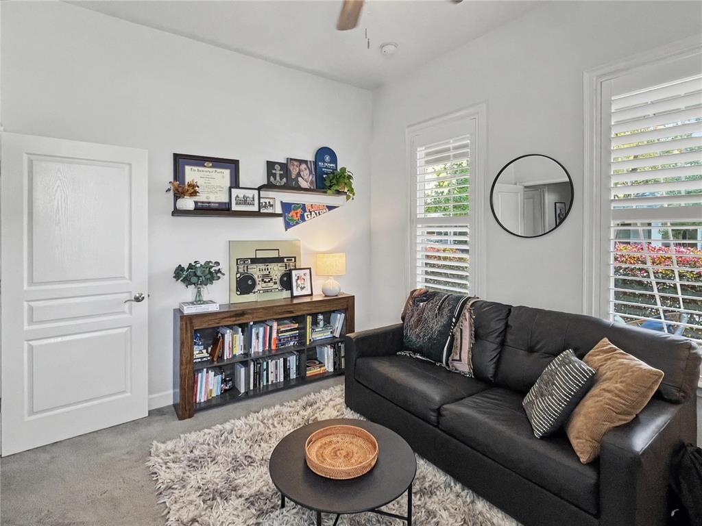 12912 Southwest 3rd Place Newberry, FL 32669 - Photo 25 of 38 a living room with furniture a rug and a window