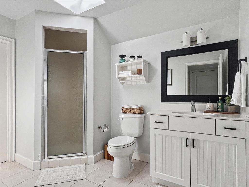 12912 Southwest 3rd Place Newberry, FL 32669 - Photo 28 of 38 a bathroom with a toilet sink and mirror