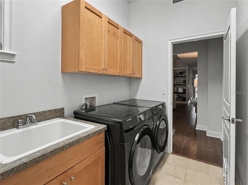12912 Southwest 3rd Place Newberry, FL 32669 - Photo 29 of 38 a utility room with sink dryer and washer