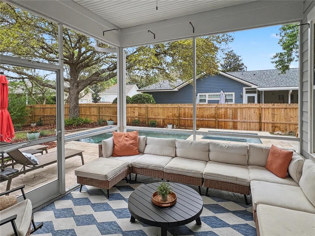 12912 Southwest 3rd Place Newberry, FL 32669 - Photo 30 of 38 a outdoor living space with patio furniture and a fireplace