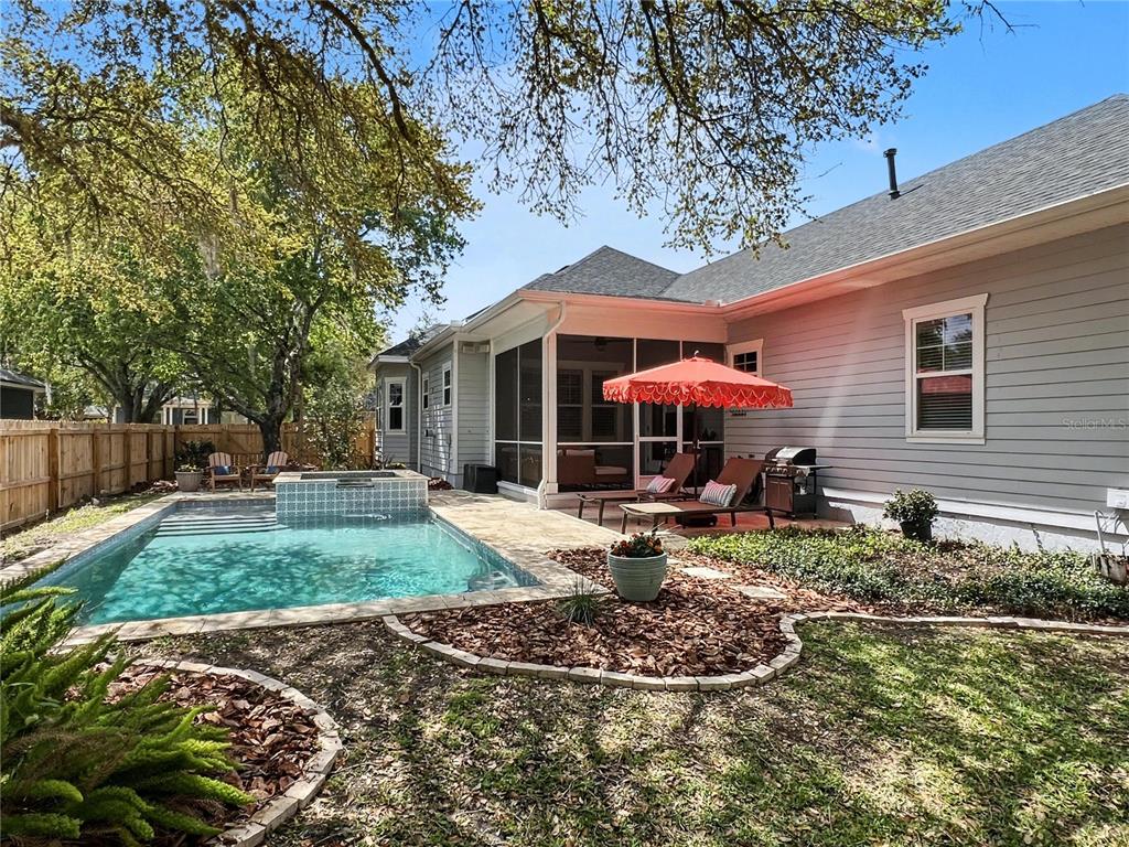 12912 Southwest 3rd Place Newberry, FL 32669 - Photo 33 of 38 a front view of a house with garden and porch