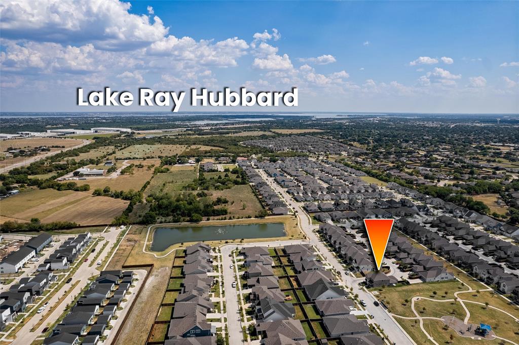 8715 Royal Star Road Rowlett, TX 75089 - Photo 39 of 39 Aerial perspective showcasing a residential neighborhood with Lake Ray Hubbard in the distance