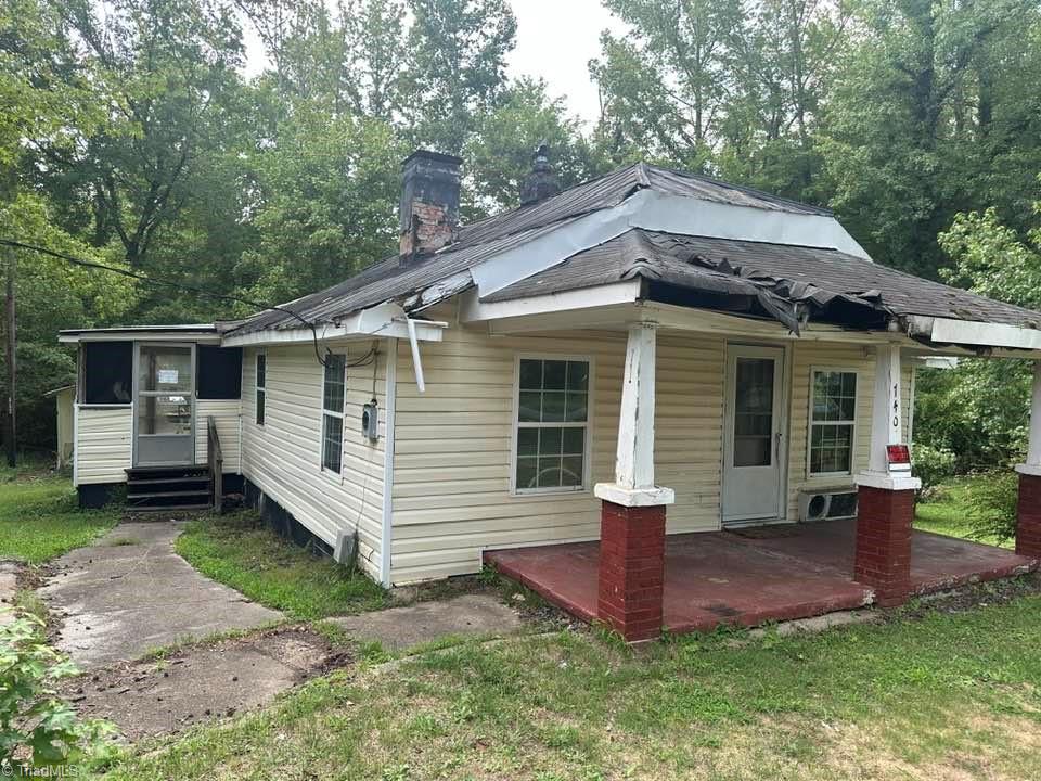 740 Shady Grove Road Eden, NC 27288 - Photo 2 of 8 Enclosed Porch with Laundry connections