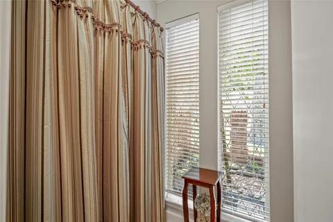 a view of a window and a table chair