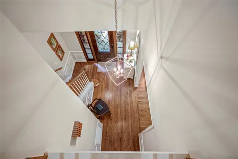 a view of staircase with rug