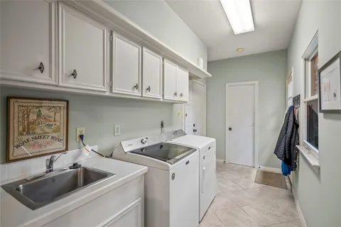 a kitchen that has a sink and a stove