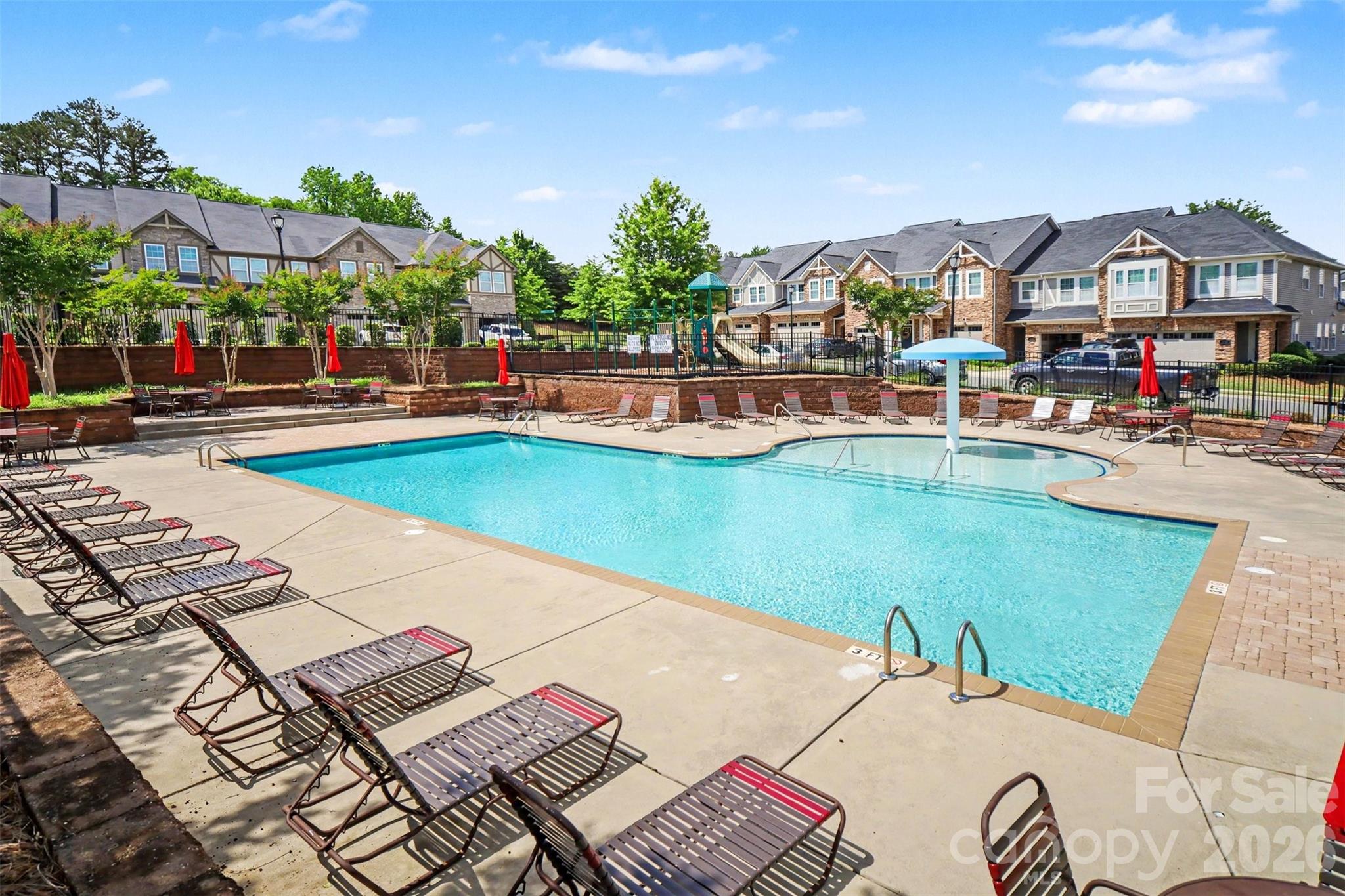 1029 Archibald Avenue Fort Mill, SC 29708 - Photo 41 of 45 a view of a swimming pool with lounge chairs in front of house