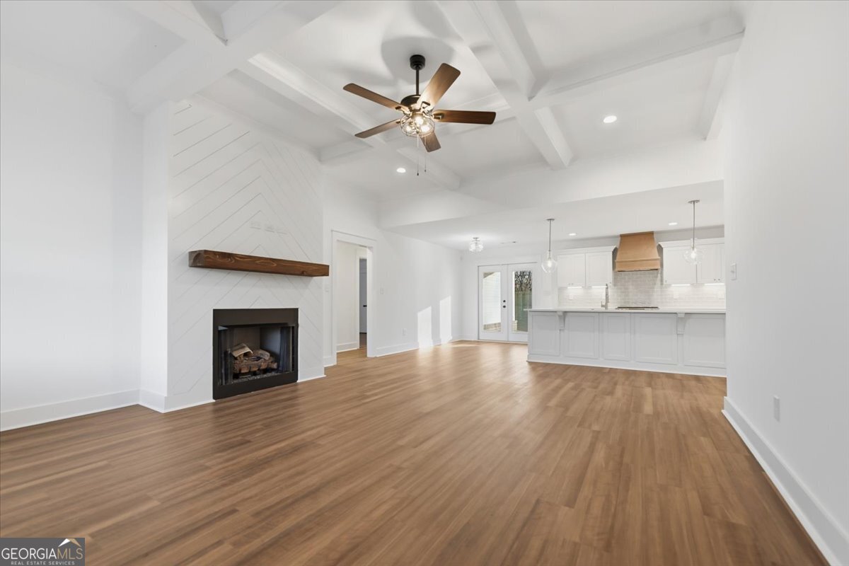 514 New Hope Drive Perry, GA 31069 - Photo 13 of 37 a view of empty room with wooden floor fireplace and a window