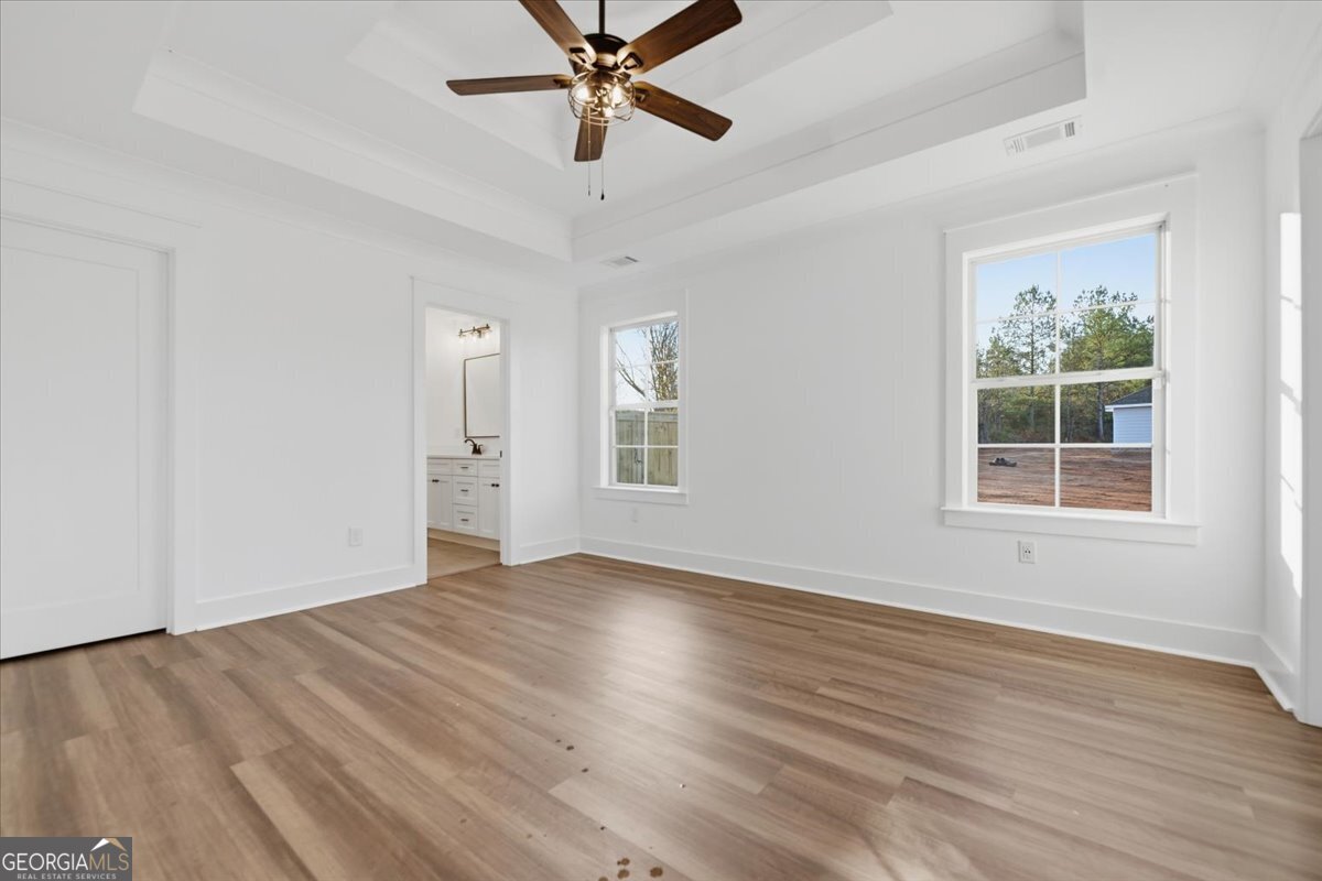 514 New Hope Drive Perry, GA 31069 - Photo 15 of 37 a view of an empty room with wooden floor and a window