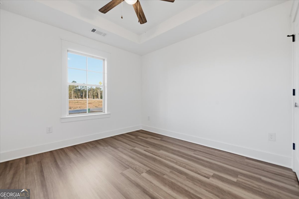514 New Hope Drive Perry, GA 31069 - Photo 24 of 37 wooden floor in an empty room with a window