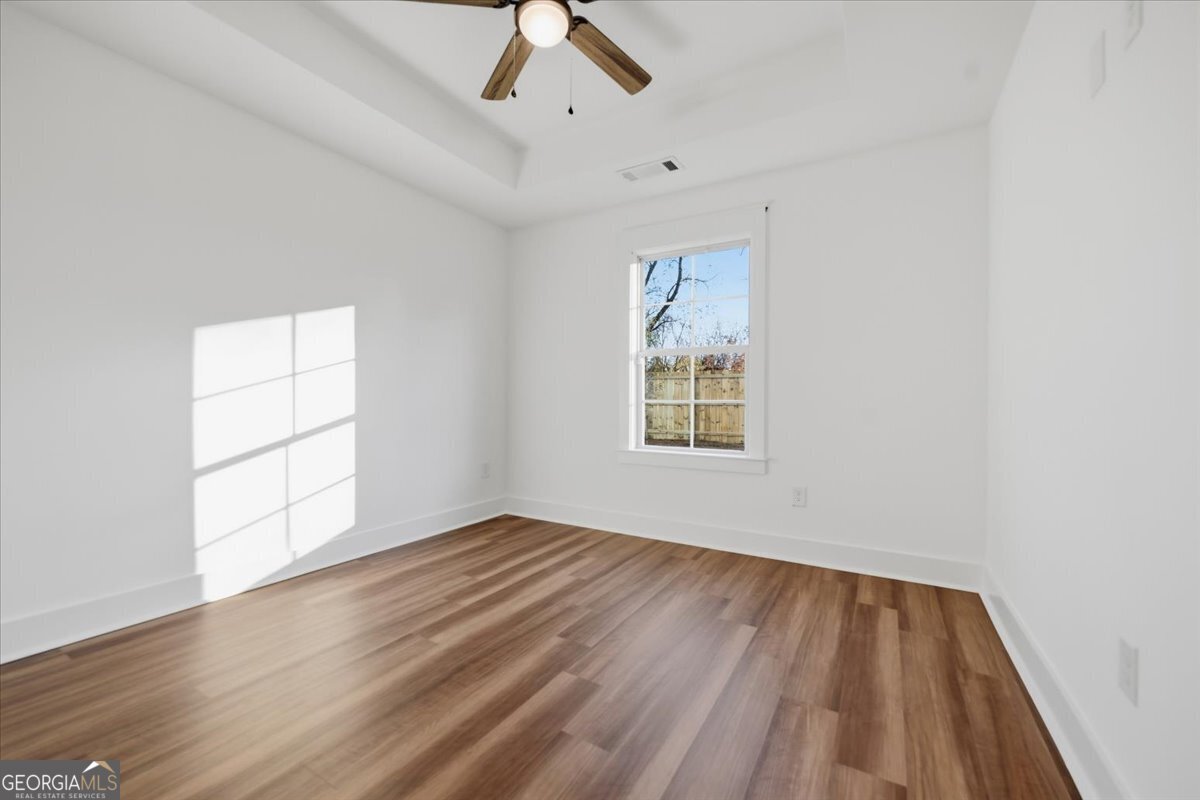 514 New Hope Drive Perry, GA 31069 - Photo 28 of 37 wooden floor in an empty room with a window