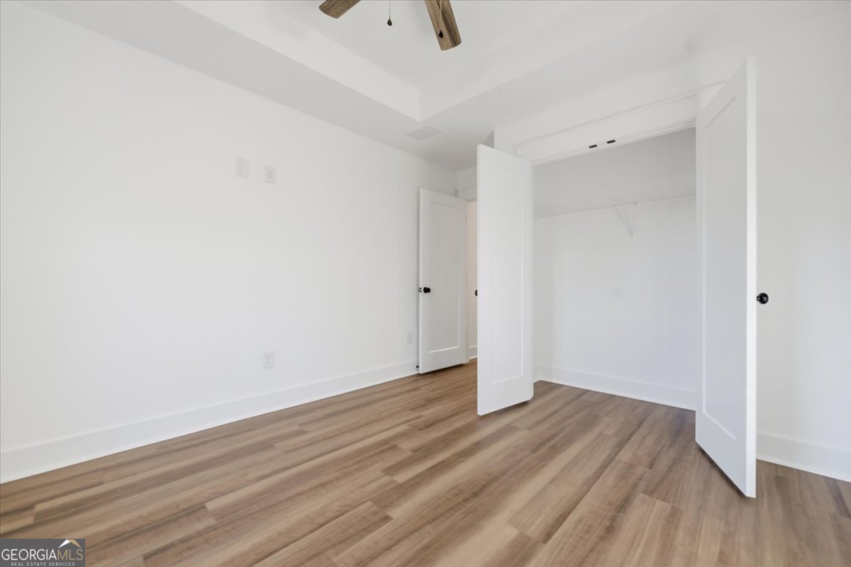 514 New Hope Drive Perry, GA 31069 - Photo 29 of 37 a view of an empty room with wooden floor