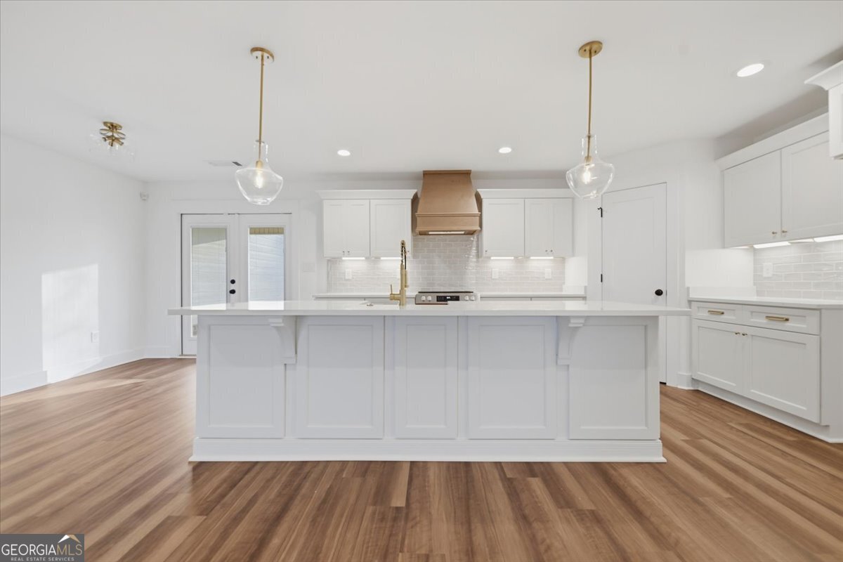 514 New Hope Drive Perry, GA 31069 - Photo 5 of 37 a view of kitchen with wooden floor and window