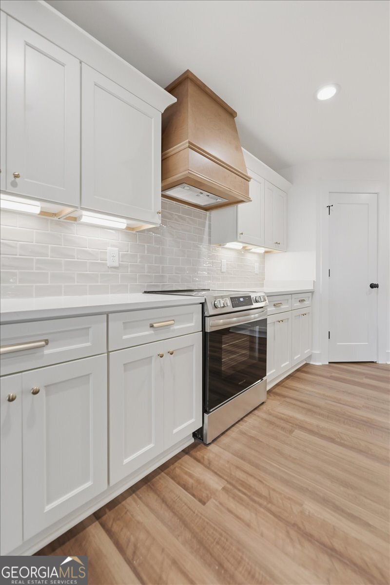 514 New Hope Drive Perry, GA 31069 - Photo 10 of 37 a kitchen with white cabinets stainless steel appliances and sink