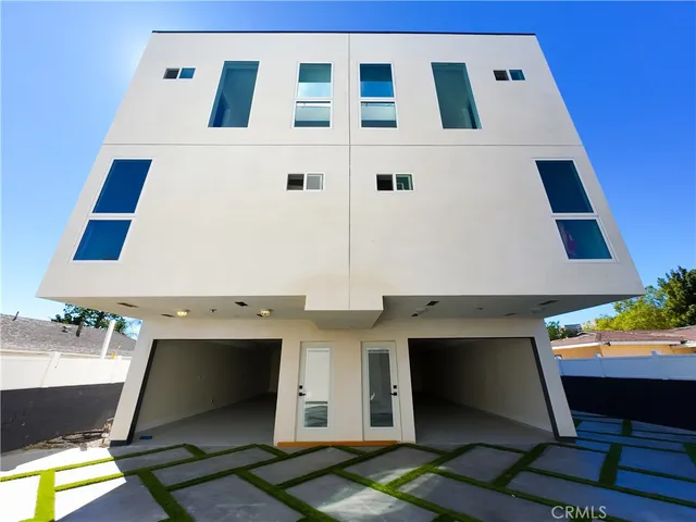 a view of a patio with table and chairs