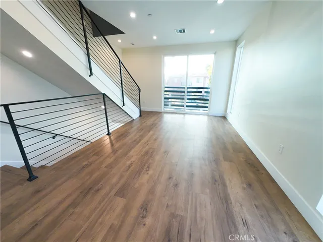 wooden view of an empty room with wooden floor