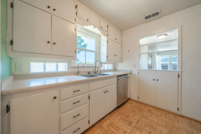 a view of an empty room with windows