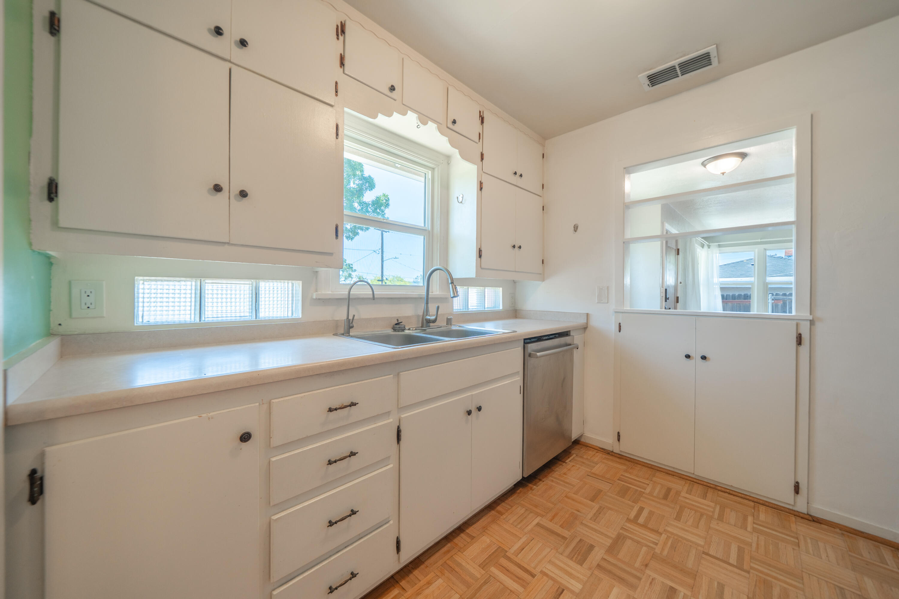 1550 Barbara Road Redding, CA 96003 - Photo 12 of 50 a bathroom with a granite countertop sink mirror and cabinets