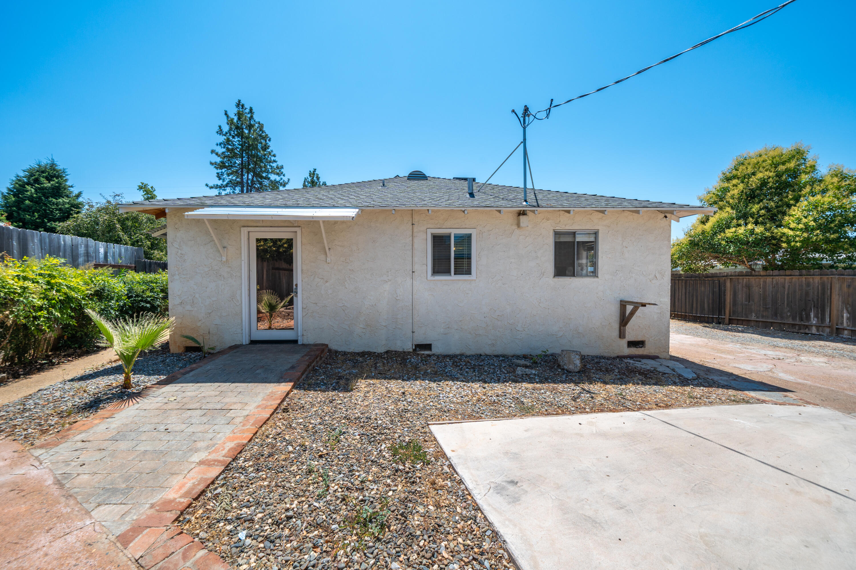 1550 Barbara Road Redding, CA 96003 - Photo 26 of 50 a front view of a house with a yard
