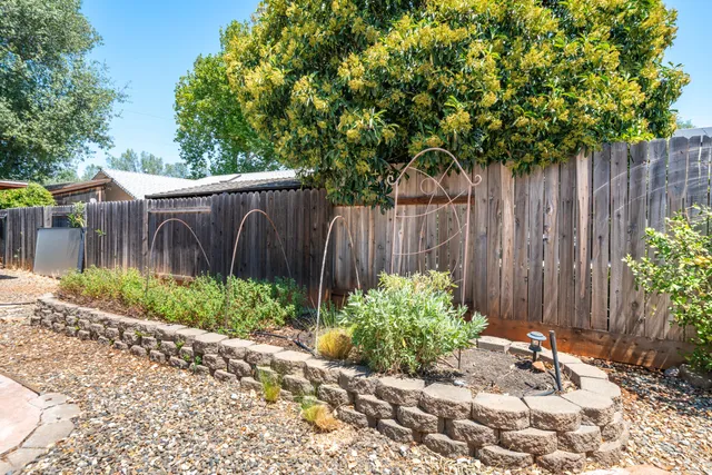 a kitchen with stainless steel appliances granite countertop a stove a refrigerator and a microwave