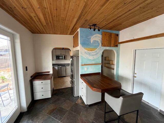 1550 Barbara Road Redding, CA 96003 - Photo 42 of 50 a kitchen with stainless steel appliances granite countertop a stove a refrigerator and a microwave