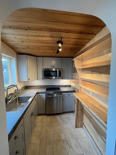 1550 Barbara Road Redding, CA 96003 - Photo 43 of 50 a kitchen with stainless steel appliances granite countertop a sink stove and cabinets