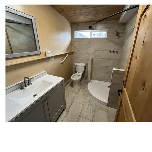 1550 Barbara Road Redding, CA 96003 - Photo 44 of 50 a bathroom with a sink a toilet and a mirror