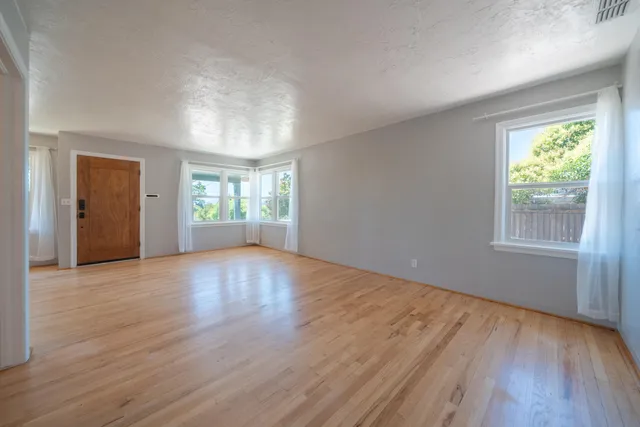 a kitchen with granite countertop a sink stainless steel appliances and cabinets