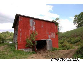 9999 Clark Road Marshall, NC 28753 - Photo 5 of 12 a view of a small barn with a yard
