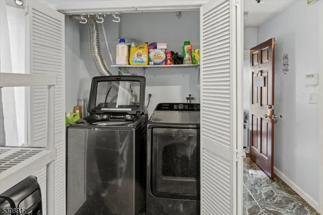 a kitchen with a refrigerator and a stove