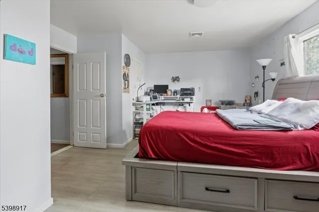 a bedroom with a bed and closet