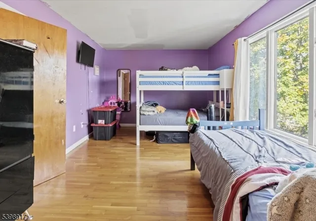 a bed room with a bed and a window