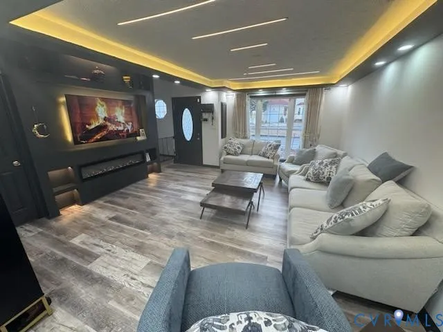 a living room with furniture and a flat screen tv
