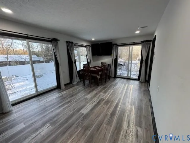 a view of livingroom with furniture and hardwood floor