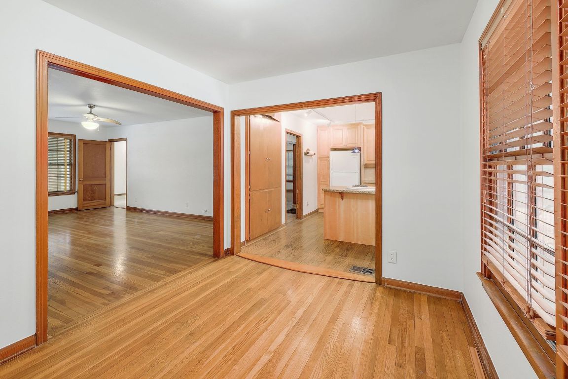 1205 Palo Duro Road Austin, TX 78757 - Photo 11 of 31 a view of a room with wooden floor and a bathroom
