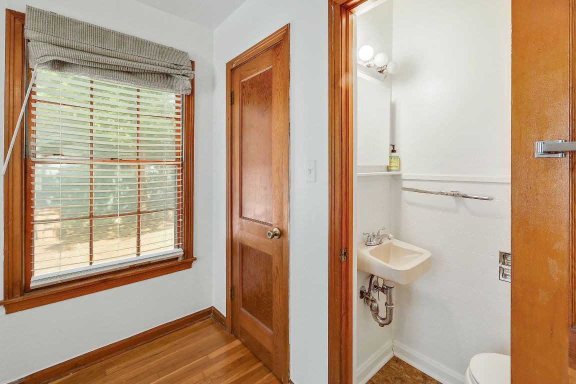 1205 Palo Duro Road Austin, TX 78757 - Photo 17 of 31 a bathroom with a toilet and a shower