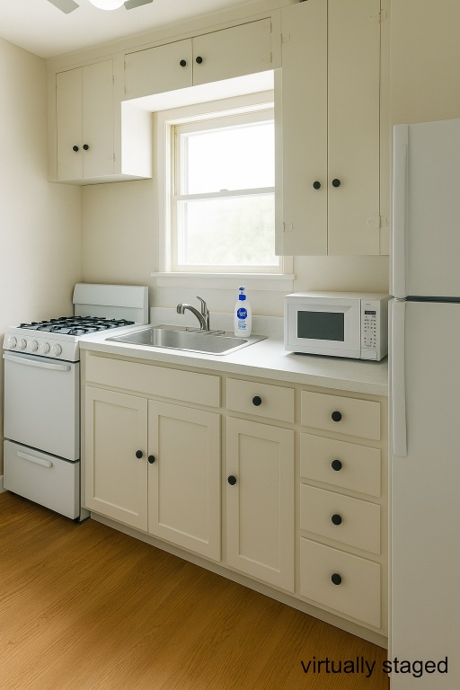 1205 Palo Duro Road Austin, TX 78757 - Photo 28 of 31 a kitchen with cabinets appliances a sink and a window