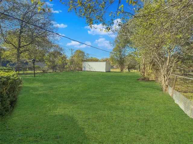a backyard of a house with lots of green space