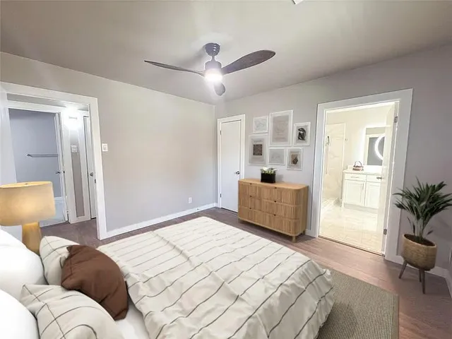 a bedroom with furniture and a window