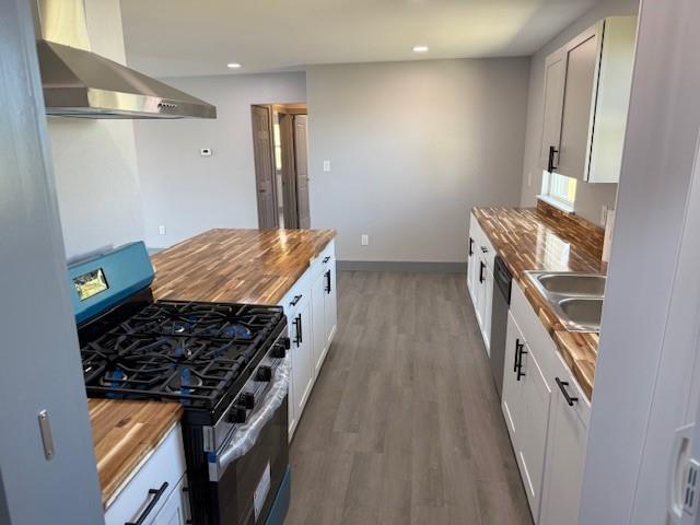 5845 Haney Drive Watauga, TX 76148 - Photo 13 of 37 a kitchen with a stove and a wooden floor